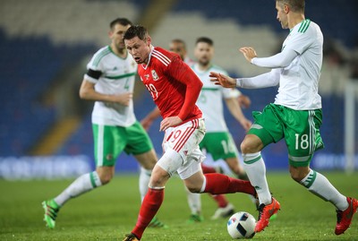 240316 - Wales v Northern Ireland, International Friendly - Simon Church of Wales takes on Aaron Hughes of Northern Ireland