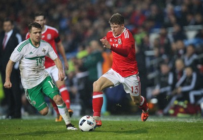 240316 - Wales v Northern Ireland, International Friendly - Lloyd Isgrove of Wales takes on Jamie Ward of Northern Ireland