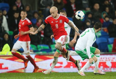 240316 - Wales v Northern Ireland, International Friendly - David Cotterill of Wales is tackled by Daniel Lafferty of Northern Ireland