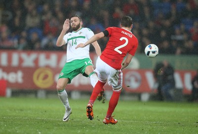 240316 - Wales v Northern Ireland, International Friendly - Stuart Dallas of Northern Ireland challenges Chris Gunter of Wales