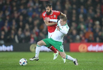 240316 - Wales v Northern Ireland, International Friendly - Steven Davis of Northern Ireland tangles with Joe Ledley of Wales