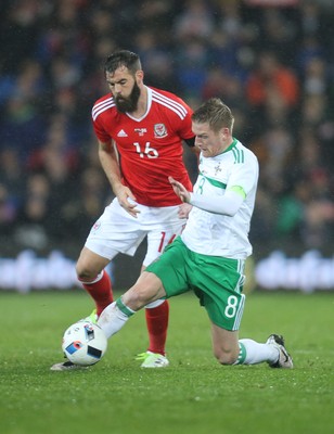 240316 - Wales v Northern Ireland, International Friendly - Steven Davis of Northern Ireland tangles with Joe Ledley of Wales