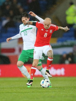 240316 - Wales v Northern Ireland, International Friendly - David Cotterill of Wales and Steven Davis of Northern Ireland compete for the ball