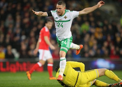 240316 - Wales v Northern Ireland, International Friendly - Conor Washington of Northern Ireland is robbed of the ball by Wales’ goalkeeper Wayne Hennessey