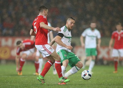 240316 - Wales v Northern Ireland, International Friendly - Conor Washington of Northern Ireland closes in on James Chester of Wales
