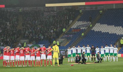 240316 - Wales v Northern Ireland, International Friendly - Teams line up for a minutes silence in memory of those caught up in the terrorist attack in Brussels