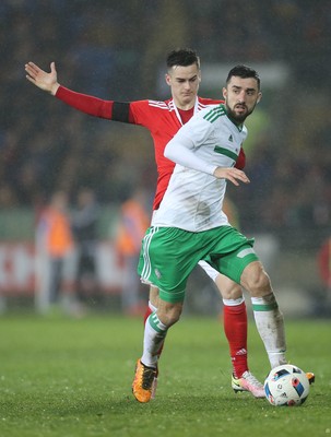 240316 - Wales v Northern Ireland, International Friendly - Tom Lawrence of Wales and Conor McLaughlin of Northern Ireland compete for the ball