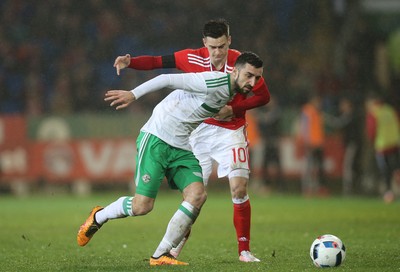 240316 - Wales v Northern Ireland, International Friendly - Tom Lawrence of Wales and Conor McLaughlin of Northern Ireland compete for the ball