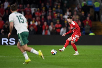 310326 - Wales v Northern Ireland - International Friendly - Neco Williams of Wales is challenged by Justin Devenny of Northern Ireland