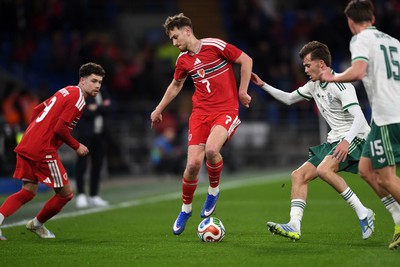310326 - Wales v Northern Ireland - International Friendly - David Brooks of Wales is challenged by Justin Devenny of Northern Ireland