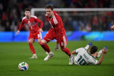 310326 - Wales v Northern Ireland - International Friendly - Joe Rodon of Wales is challenged by Jamie Donley of Northern Ireland