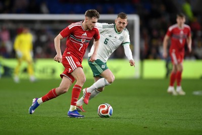 310326 - Wales v Northern Ireland - International Friendly - David Brooks of Wales is challenged by George Saville of Northern Ireland