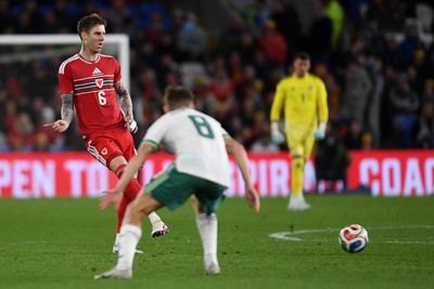 310326 - Wales v Northern Ireland - International Friendly - Joe Rodon of Wales is challenged by Callum Marshall of Northern Ireland