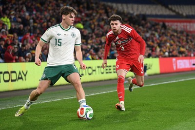 310326 - Wales v Northern Ireland - International Friendly - Neco Williams of Wales is challenged by Justin Devenny of Northern Ireland
