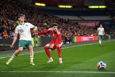 310326 - Wales v Northern Ireland - International Friendly - Neco Williams of Wales is challenged by Justin Devenny of Northern Ireland