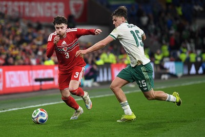 310326 - Wales v Northern Ireland - International Friendly - Neco Williams of Wales is challenged by Justin Devenny of Northern Ireland