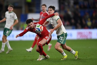 310326 - Wales v Northern Ireland - International Friendly - Neco Williams of Wales is challenged by Justin Devenny of Northern Ireland