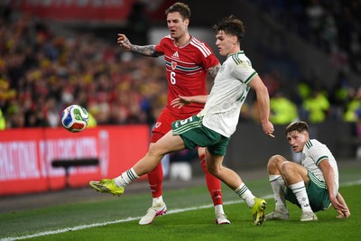 310326 - Wales v Northern Ireland - International Friendly - Joe Rodon of Wales is challenged by Justin Devenny of Northern Ireland