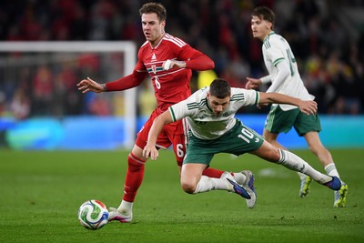 310326 - Wales v Northern Ireland - International Friendly - Joe Rodon of Wales is challenged by Jamie Donley of Northern Ireland