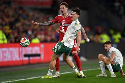 310326 - Wales v Northern Ireland - International Friendly - Joe Rodon of Wales is challenged by Justin Devenny of Northern Ireland