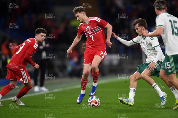 310326 - Wales v Northern Ireland - International Friendly - David Brooks of Wales is challenged by Justin Devenny of Northern Ireland
