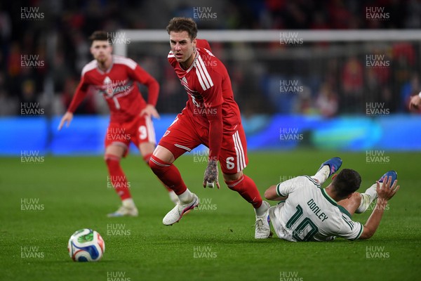 310326 - Wales v Northern Ireland - International Friendly - Joe Rodon of Wales is challenged by Jamie Donley of Northern Ireland
