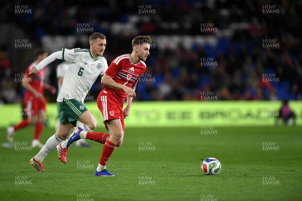 310326 - Wales v Northern Ireland - International Friendly - David Brooks of Wales is challenged by George Saville of Northern Ireland