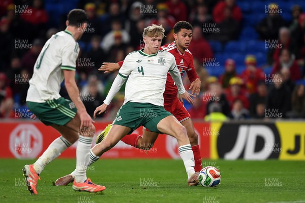 310326 - Wales v Northern Ireland - International Friendly - Brennan Johnson of Wales is challenged by Tom Atcheson of Northern Ireland