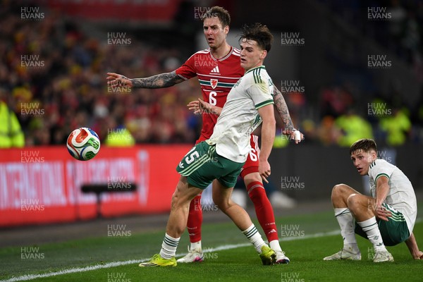 310326 - Wales v Northern Ireland - International Friendly - Joe Rodon of Wales is challenged by Justin Devenny of Northern Ireland