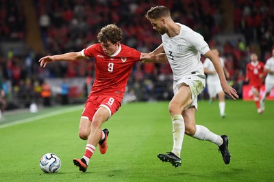 011026 - Wales v Norway - UEFA Nations League - Lewis Koumas of Wales is challenged by Kristoffer Vassbakk Ajer of Norway