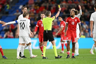 011026 - Wales v Norway - UEFA Nations League - Both Martin Odegaard of Norway and Sorba Thomas of Wales are booked after things boil over