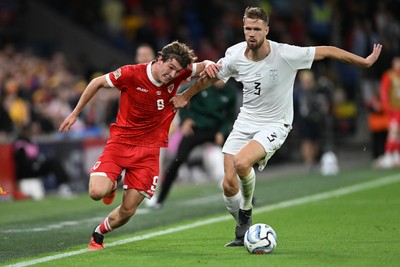011026 - Wales v Norway - UEFA Nations League - Lewis Koumas of Wales is challenged by Kristoffer Vassbakk Ajer of Norway