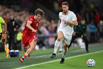 011026 - Wales v Norway - UEFA Nations League - Lewis Koumas of Wales is challenged by Kristoffer Vassbakk Ajer of Norway