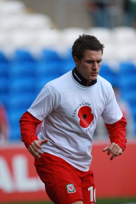 12.11.11 -  Wales v Norway, International Friendly -  Wales' Aaron Ramsey warms up in a T shirt to mark Rememberance Sunday 