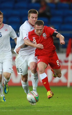 12.11.11 -  Wales v Norway, International Friendly -  Wales' Craig Bellamy is brought down by Norway's Espen Ruud  