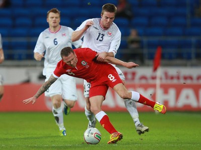 12.11.11 -  Wales v Norway, International Friendly -  Wales' Craig Bellamy is brought down by Norway's Espen Ruud  