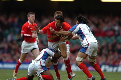 11.11.06  Wales v Pacific Islands  Wales Mike Phillips is tackled byLomeFa'atau and Hale T-Pole 