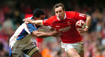 11.11.06  Wales v Pacific Islands  Wales Mark Jones hands off Semo Sititi 