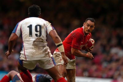 11.11.06  Wales v Pacific Islands Wales' Sonny Parker eyes up the massive Epi Taione. 