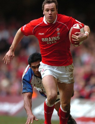 11.11.06  Wales v Pacific Islands  Wales Mark Jones leaves Semo Sititi floundering.  