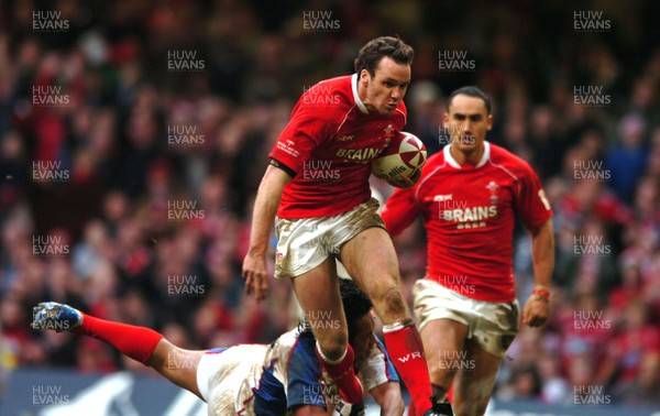 11.11.06  Wales v Pacific Islands  Wales Mark Jones slips tackle by Daniel Leo. 