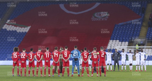 141117 - Wales v Panama, International Friendly match - The Wales team lineup for minutes silence in from of a giant Wales shirt
