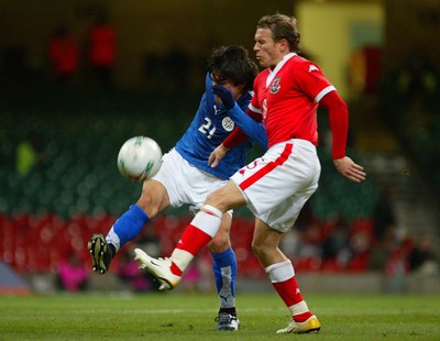 010306Wales v Paraguay, Friendly International, Millennium Stadium, Cardiff Wales' Craig Bellamy is tackled by Denis Caniza  