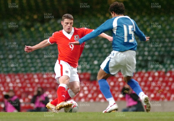 010306 - Wales v Paraguay - International Friendly - The Millennium Stadium - Wales' Jason Koumas tries to take the ball past  Juan D Caceres 