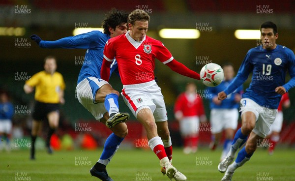 010306Wales v Paraguay, Friendly International, Millennium Stadium, Cardiff Wales' Craig Bellamy is tackled by Denis Caniza  