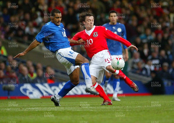 010306Wales v Paraguay, Friendly International, Millennium Stadium, Cardiff Wales' Simon Davies is challenged by Paulo da Silva  