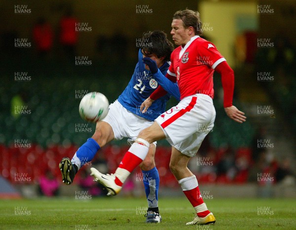 010306Wales v Paraguay, Friendly International, Millennium Stadium, Cardiff Wales' Craig Bellamy is tackled by Denis Caniza  