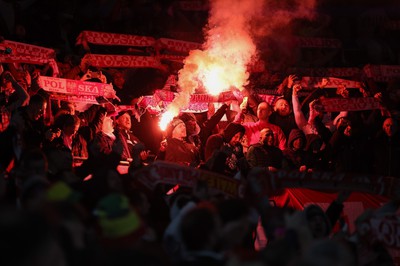 260324 - Wales v Poland, Euro 2024 qualifying Play-off Final - Polish fans set off flares during the anthem