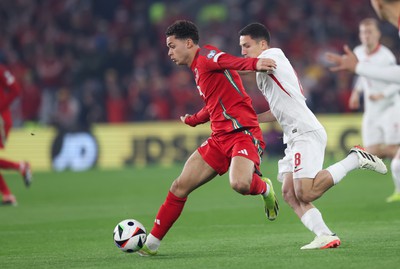 260324 - Wales v Poland, Euro 2024 qualifying Play-off Final - Brennan Johnson of Wales breaks forward