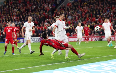 260324 - Wales v Poland, Euro 2024 qualifying Play-off Final - Kieffer Moore of Wales is denied a penalty as he goes down